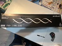 Sealed Artika DNA fixture box top view showing product image and branding