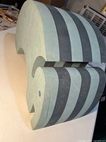 Side profile of striped EVA foam elephant