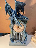 Front view showing dragons, clock face, reaper figures