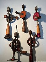 Group shot of four vintage hand drills