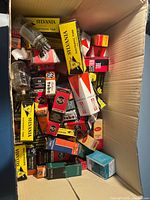 Large box filled with assorted boxed and loose vacuum tubes