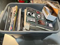 Overview of tote showing yearbooks, binder with cards, and small card box