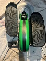 Top view of green Stamina pedal exerciser showing both foot platforms and central frame