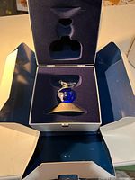 Figurine in open presentation case