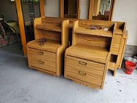 Front view of both Palliser nightstands showing drawers, shelves, cords