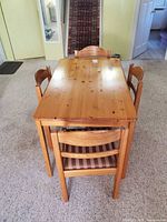 Top view showing table surface and chairs tucked underneath