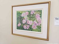 Frontal view of framed painting on wall showing entire artwork and frame