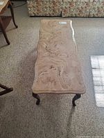 Top view of rectangular marble-top coffee table showing marble surface and overall shape