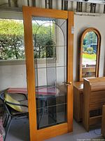 Front view of oak full-lite door showing entire frame and glass panel