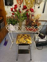 Front view showing chrome frame, floral seat and surrounding context