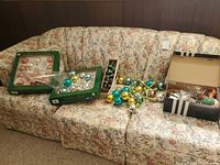 Overview of all ornament boxes and loose balls on sofa