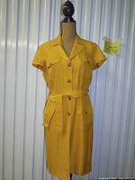Full front view of golden yellow Anne Klein shirt dress on mannequin