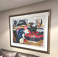 Full view of framed serigraph on wall
