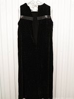 Full-length view of dress hanging, showing overall style and pattern