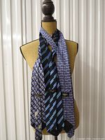 Three neckties draped on mannequin