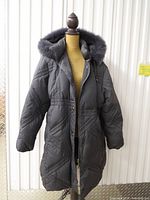 Full view of charcoal Nuage long parka on mannequin