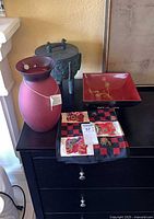 Group shot of vase, bowl on stand, tripod vessel
