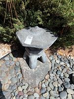 Lantern roof resting on pedestal base, tag visible