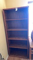 Front view of bookcase showing shelves and wood grain
