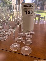 Group of eight crystal champagne flutes on table