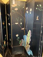 Full view of black-side panels showing floral and bird painting