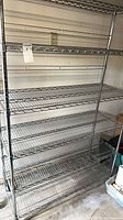 Full view of stainless steel wire shelving unit with six shelves