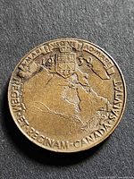 Obverse of 1939 Royal Visit to Canada medallion showing map, shield and inscriptions