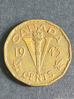 Reverse of 1943 Victory nickel showing torch, V, date