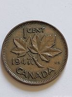 Reverse of 1947 Canada 1 Cent coin showing maple leaf variety