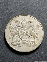 Obverse showing coat of arms and wear