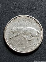 reverse side showing bobcat design and denomination