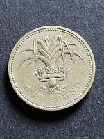 Obverse side showing thistle emblem and denomination