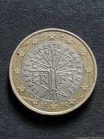 Obverse showing Tree of Life design, stars, RF monogram, date 1999