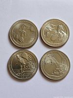 Reverse sides showing designs of all four commemorative quarters