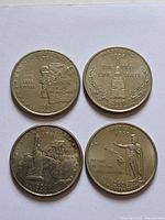 Reverse sides of four state quarters: New Hampshire 2000, Maryland 2000, New York 2001, Hawaii 2008