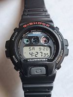 Front view showing dial, logos, and display