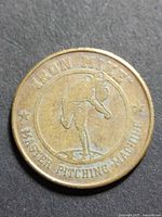 Obverse of token showing Iron Mike pitcher design and text
