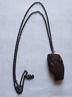 Full view of necklace showing pendant and entire chain