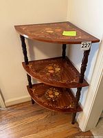 Full view of corner étagère showing three tiers and turned legs