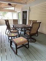 full view of dining table, chairs, side table and ottoman