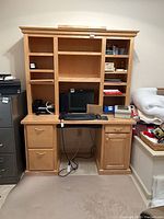 Front view of complete desk and hutch showing drawers, keyboard tray, hutch shelves