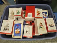 Overview of tote containing boxed Hallmark ornaments