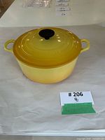 Le Creuset yellow Dutch oven with lid on tabletop