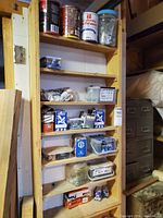 Full wooden shelf with various fastener containers
