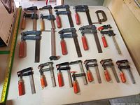 Tabletop view of all 16 clamps arranged