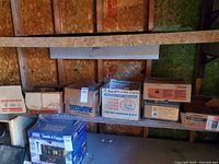 Overall view of shelf with multiple boxes of nails and spikes