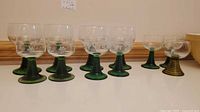 Group shot of all 11 green-stem goblets showing three sizes