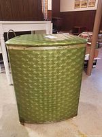 Front view of avocado green starburst hamper with lid closed
