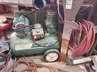 Full view of Speedaire 5Z002A compressor showing tank, motor, pump, wheels