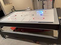 Full view of air hockey surface on rotating table
